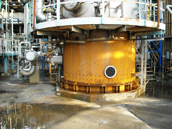 Column skirt after being fireproofed and sanded in preparation for corrosion inspection.